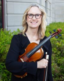 Portrait of Violin II musician Kris Zaloudek