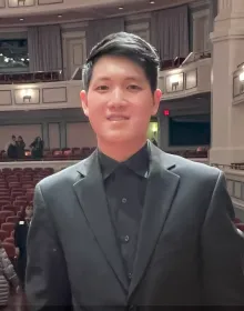 Portrait of Violin I musician Byron Fan