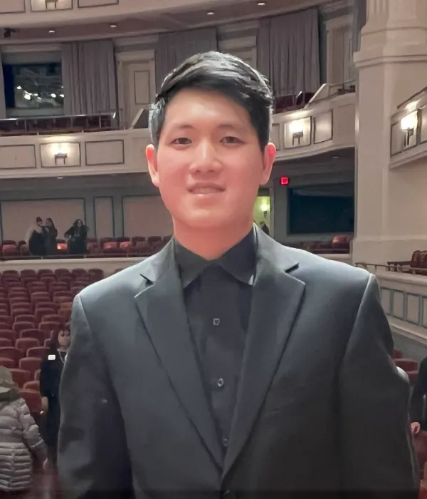 Portrait of Violin I musician Byron Fan 