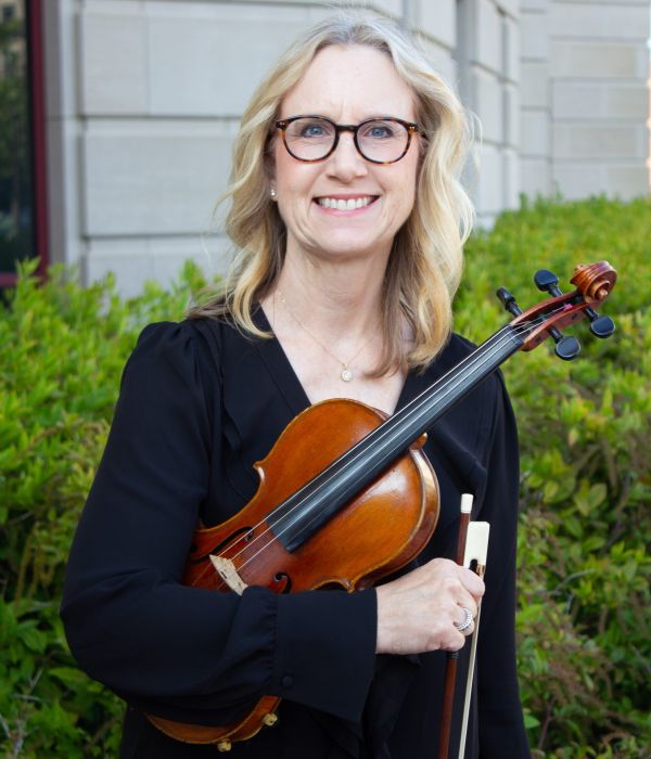 Portrait of Violin II musician Kris Zaloudek