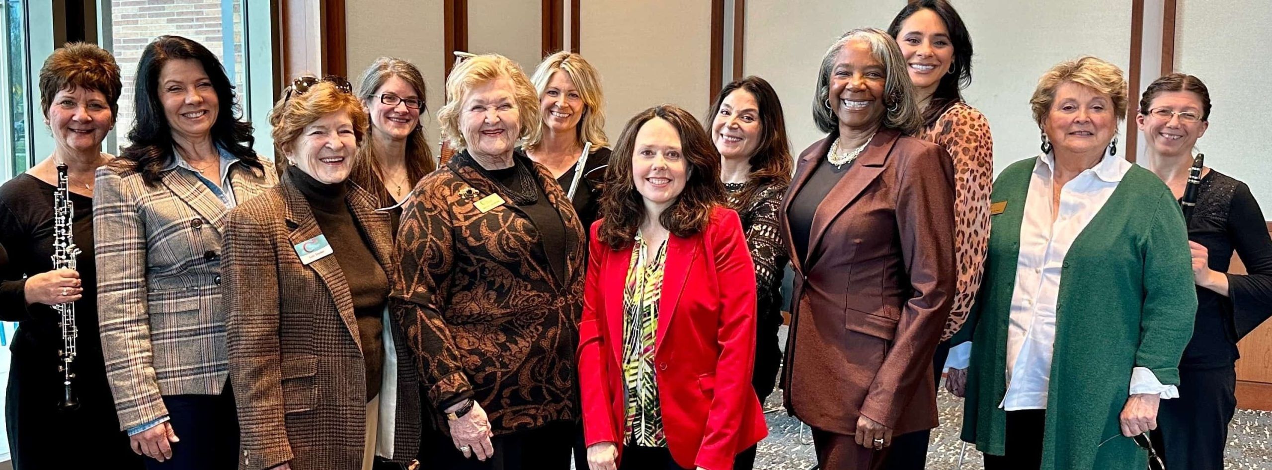 Group of women posing for photo after the Carmel Symphony Orchestra's Women in Leadership panel discussion at the Carmel Clay Public Library