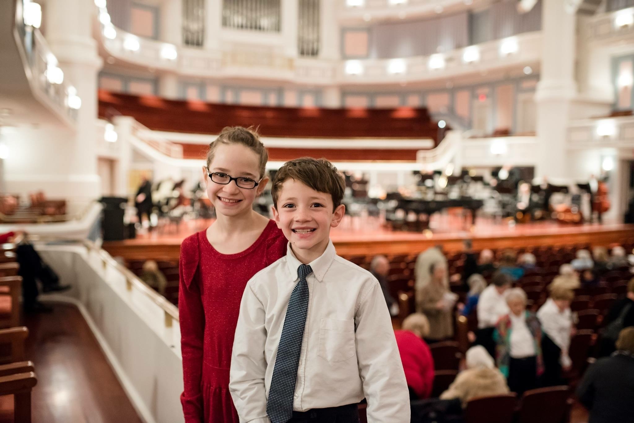 Two children dressed up at Carmel Symphony Orchestra concert in the Payne and Mencias Palladium concert hall.