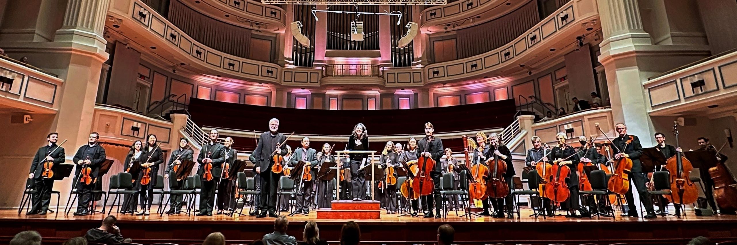 Carmel Symphony Orchestra on stage standing after Symphonic Odyssey cropped for home page slideshow