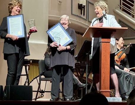 Jan Brill, Ann Manship andNAndy Sutton on stage April 18, 2026 for retirement ceremony for these long-time musicians with Carmel Symphony Orchestra